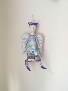 an angel figurine hanging on the wall