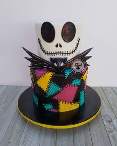 a decorated cake with a skull on top