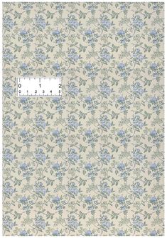 an old wallpaper with blue flowers on it and a ruler in the middle that says,