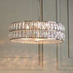 a chandelier hanging from a ceiling in a room