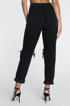 A pair of Bare Rags high-rise mom jeans featuring an open ripped knee detail, classic 5-pocket construction, zip-fly closure, and a cropped rolled hem. Our Busted Mom Jeans are the perfect jeans for all year long. These come in Light Blue too! -Rise: 11.5”, Inseam: 25.5” (Measurements taken from size 5)-Model is 5'9" and wearing a size 3-Waistline runs small-Fabric: 99% Cotton, 1% Lycra