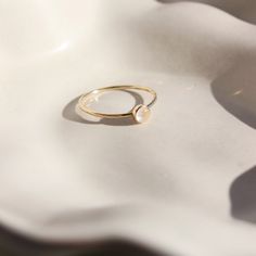 14k gold fill moonstone ring 4mm set on a white plate. This ring features a simple band with a moonstone gemstone bezeled to it. Moonstone Rings, Inner Growth, Moonstone Stone, Forever Jewelry, Detailed Ring, Moonstone Jewelry, Childrens Jewelry, Ring Sizes, Moonstone Ring