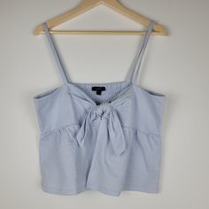 J. Crew Blue Sleeveless Baby Doll Tank Smocked Back Size Xl Front Bow Tie And Loop Close Open Belly Smocked Back Nwt Breathable Baby Doll Cami 66% Cotton 34% Polyester Length 23" Pit To Pit 19" Blue Summer Tank Top With Tie Straps, Summer Blue Tank Top With Tie Straps, Blue Tank Top With Tie Straps For Summer, Blue Summer Tops With Tie Straps, Blue Tie Straps Tops For Summer, Blue Ruffled Cami Tank Top, Blue Sleeveless Tops With Tie Straps, Cotton Tank Top With Smocked Bodice For Vacation, Blue Cotton Tops With Tie Straps