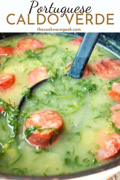 a pot full of soup with shrimp and spinach