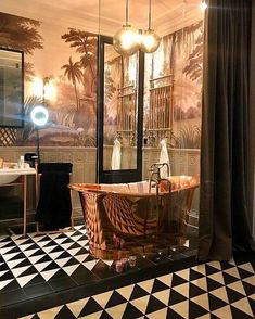 the bathroom is decorated in black and white with a tiger print bathtub next to a large mirror