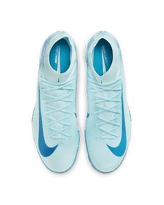 a pair of blue nike shoes on a white background with the shoe laces down