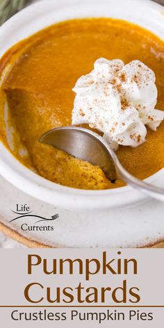 pumpkin custards are topped with whipped cream in a white bowl on a plate