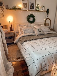 a bed with white sheets and pillows in a room