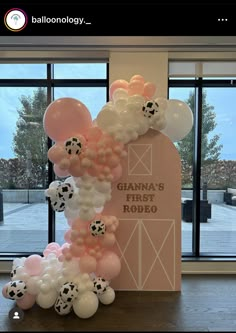 the balloon arch is decorated with soccer balls