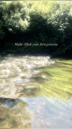 a river that has some water and trees in the background with a quote on it