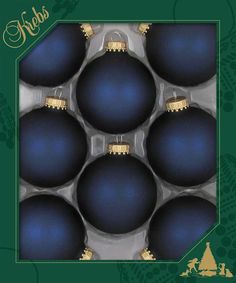 six blue christmas balls in a green box