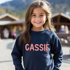 Personalized Name Youth Toddler Sweatshirt, Youth Sweatshirt, College Style Youth Sweatshirt, Personalized Kid Sweatshirt Made with a medium-heavy weight fabric to keep you warm and cozy in the colder months Blend of 50% cotton and 50% polyester (8.0 oz/yd² (271.25 g/m A classic fit along with the crew neckline deliver a comfy wearing experience with a clean-cut style. Meanwhile, the double-needle stitching at the shoulder, armhole, neck, waistband, and cuff seams add top-tier durability. No itchiness thanks to the gray, pearlized tear-away label.We use Gildan sweatshirt so you know they are durable, reliable and machine washable. Why we use Gildan sweatshirts: Made using 100% ethically grown US cotton. Gildan is also a member of the US Cotton Trust Protocol ensuring ethical and sustainabl Sporty Cotton Sweatshirt With Name Print, Custom Name Long Sleeve Cotton Sweatshirt, Multicolor Crew Neck T-shirt With Name Print, Personalized Name Print Long Sleeve Sweatshirt, Girl Sweat, Gildan Sweatshirt, College Style, Gildan Sweatshirts, Great Team