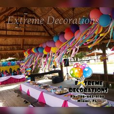 a party with balloons and streamers hanging from the ceiling is featured in this ad for extreme decorations