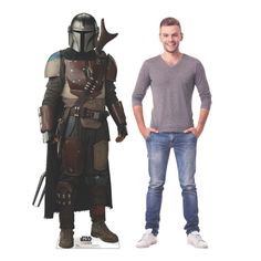 a man standing next to a cardboard cutout of the character boba fett