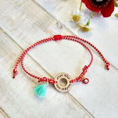 This March Charm Bracelet, Red and White Cord Bracelet, is handmade with love from Greece. This fashionable spring bracelet is a variation of Greek traditional "March" Bracelet. It consists of a wooden charm "Martis" motif,  knotted with a braided red and white waxed thread  and adorned with a red enamel evil eye charm. Moreover, a cute teal tassel adds a playful touch to this folk bracelet. It's adjustable, with a slide macrame knot, in order to fit any wrist size. The ideal spring gift for a g Red Bohemian Charm Bracelet For Gift, Bohemian Style Red Charm Bracelet For Gift, Handmade Red Charm Bracelet As Gift, Handmade Red Charm Bracelet, March Bracelet, Greek Bracelet, Bracelet Cordon, Spring Bracelet, Country Wear