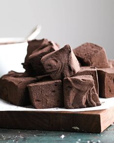 chocolate chunks on a plate with spoon in the background