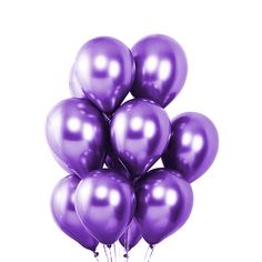 a bunch of purple balloons floating in the air