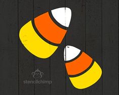 an orange and white candy corn on a black background with the word stencichump written below it