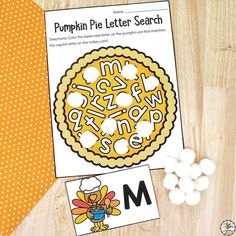 the pumpkin pie letter search is next to some marshmallows