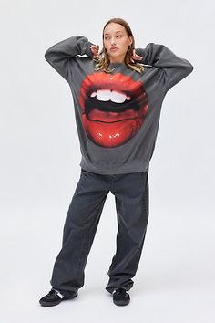 Staple pullover sweatshirt made bold with a photoreal lips graphic across the front. Features a crew neckline and drop shoulder long sleeves for a slouchy vibe. Only at Urban Outfitters. Features Lips Photoreal graphic crew neck sweatshirt Graphic pullover sweatshirt Soft & stretchy midweight knit Crew neckline with drop shoulders and long sleeves Photoreal lips graphic across the front Ribbed knit banded hemline Oversized, slouchy fit Tunic length Easy pull-over style UO exclusive Content + Care 80% Cotton, 20% polyester Machine wash Imported Size + Fit Model in Black is 5’7" and wearing size S/M Measurements taken from size S/M Chest: 50" Length: 29" | Lips Photoreal Graphic Crew Neck Sweatshirt in Black at Urban Outfitters Urban Outfitters Crew Neck Sweatshirt For Streetwear, Urban Outfitters Casual Graphic Print Sweatshirt, Casual Urban Outfitters Sweatshirt With Graphic Print, Urban Outfitters Relaxed Fit Crew Neck Sweatshirt, Urban Outfitters Graphic Sweatshirt For Streetwear, Urban Outfitters Tops For Streetwear In Fall, Urban Outfitters Crew Neck Sweatshirt For Fall, Trendy Long Sleeve Sweatshirt By Urban Outfitters, Trendy Long Sleeve Sweatshirt From Urban Outfitters