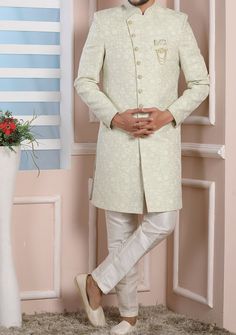 Ready-Made Sherwani With Trouser. Jacquard Brocade Fabric Top. Art Dupion Aligarhi Ready Made Trouser. Crafted in Chinese Collar Neck, and Full Sleeve. Satin Lining with Plain Work. High-Quality Matching Buttons. Please Note: The footwear shown in the picture is for presentation and photography purpose only. Color: There might be slight color variation due to lightings and flashes while photo shooting. The color may also vary because of different screen resolutions. Wash Care: Dry Clean Only. Semi-stitched Pista Green Kurta With Naqshi, Festive Full Length Kurta, Eid Resham Embroidery Full Length Sets, Full Length Kurta With Zari Work For Eid, Eid Kurta With Zari Work, Pista Green Long Sleeve Unstitched Suit For Wedding, Traditional Full-length Kurta For Diwali, Full Length Traditional Wear For Eid, Full Length Zari Work Sets For Eid