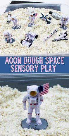 a cake with white frosting and small toy astronauts on it's sides, in front of a box that says moon dough space sensory play