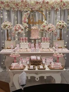 a table topped with lots of cakes and desserts