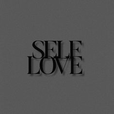 the word self love in black on a gray background