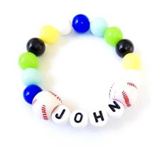 Hello and welcome*** Personalized boys baseball bracelet***Simple baseball themed bracelet for toddler boys. Stretchy.Great for everyday wear or party favor bags.Personalized- please leave me a note with child's name at checkout "note to seller" section.Bracelet will come pack in an organza bag. If you would like me to ship item directly to a receiver please fill their address into a shipping info. Personalized Black Beaded Bracelets, Personalized Blue Bracelets For Sports Events, Personalized Themed Beaded Bracelets For Birthday, Themed Personalized Beaded Bracelets For Birthday, Personalized Adjustable Name Bracelet For Sports Events, Sporty Personalized Name Bracelet As A Gift, Personalized Beaded Bracelets For Father's Day Birthday, Novelty Personalized Blue Bracelets, Personalized Beaded Bracelets For Birthday And Father's Day