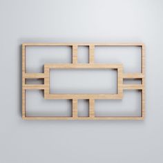 a piece of wood that has been cut into squares and rectangles on the wall