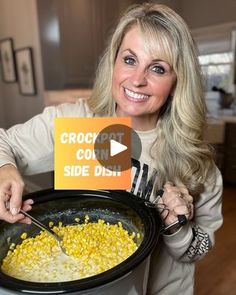 a woman holding a crock pot with corn in it and a sign that reads, crock cooke side dish