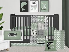 a baby crib bedding set with green and white prints on the walls, along with other items