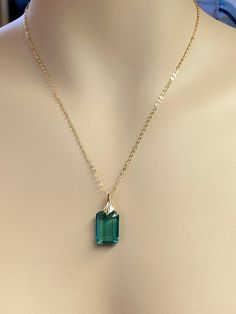 Beautiful Paraiba tourmaline pendant necklace. The faceted rectangle pendant has gorgeous ocean green color that brings lots of depth to the stone and reflect lights beautifully. The rectangle shape pendant attached to a gold-filled bail and suspended on a 14k gold fill chain. The necklace is elegant and has a lux look. * Pendant size(with the bail): 27x14 mm * Metal: 14K gold-filled * Necklace length : 44 cm / 18inc Solid gold, 14K gold-filled, sterling silver, and gemstones are my materials of Green Tourmaline Pendant, Elegant Turquoise Necklace With Rectangular Pendant, Rectangular Tourmaline Jewelry For Gifts, Rectangular Tourmaline Gemstone Jewelry, Rectangular Tourmaline Jewelry Gift, Elegant Turquoise Jewelry With Rectangular Stone, Elegant Turquoise Rectangular Stone Jewelry, Ocean Green Color, Ocean Green