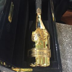 a bottle of champagne in a black box