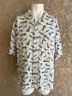 "Vintage button-up shirt with all-over fish print Made by Columbia Sportswear Size XL 55% Viscose 45% Cotton Nice soft, comfortable material. In brand new condition. Measurements laying flat Armpit to armpit 26\" (52\" total) Total length of shirt 30\" Items are shipped out within 1-2 business days. If you have any questions please feel free to message me I reply quickly. Check out the rest of my shop www.etsy.com/shop/alwaysvintagenvogue Thank you for looking and happy shopping!" Casual Patterned Shirt With Pockets, Short Sleeve Cotton Shirt With Fish Print, White Casual Shirt With Fish Print, White Short Sleeve Shirt With Fish Print, Cotton Short Sleeve Shirt With Fish Print, Casual White Fish Print Top, White Fish Print Shirt For Summer, Casual Blue Tops With Fish Print, Printed Relaxed Fit Long Sleeve Hawaiian Shirt