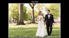 a bride and groom holding hands in the grass