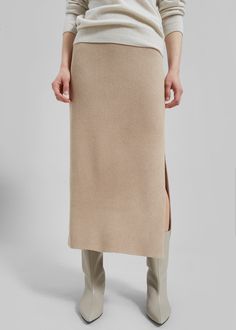 Color: Tehina Heavyweight ribbed knit fabric Regular fit Midi length Side slit Elasticated waist Slip-on style Unlined 64% Viscose 28% Polyamide 8% Spandex Hand Wash Cold By Malene Birger. Imported Sweater Knit Skirt, Ribbed Knit Fabric, Malene Birger, By Malene Birger, Midi Length, Ribbed Knit, Knit Fabric, Knitted Fabric