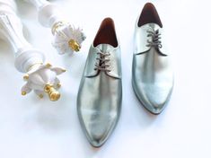 ❣ PRODUCT DESCRIPTION Elevate your style with our Silver Oxford Shoes for Women - a perfect blend of contemporary sophistication and undeniable comfort.  Crafted in stylish metallic vegan leather, these oxfords redefine fashion with a touch of silver brilliance. Designed for all-day wear, these comfortable soft shoes ensure a delightful experience on your birthday or any special celebration.  The pointy toe adds a subtle elegance, making them a fashion-forward choice for the modern woman. Indulg Silver Oxford Shoes, Oxford Shoes Women, Silver Oxfords, Wedding Flats, Chic Shoes, Leather Oxford Shoes, Soft Shoes, Contemporary Chic, Women Oxford Shoes