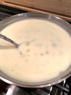 a pan filled with liquid sitting on top of an oven