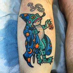 a man with a colorful tattoo on his leg