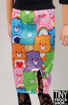 the doll is wearing a skirt with bears on it