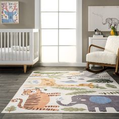 a baby's room with a rocking chair, crib and various animal rugs