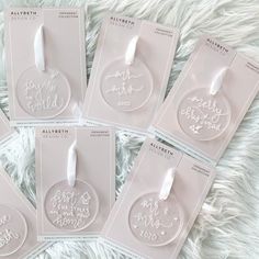 six personalized christmas ornament tags on a white furnishing