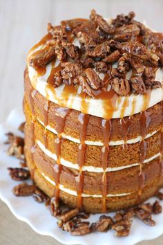 a cake with pecans and caramel drizzle on top