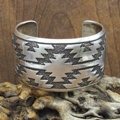 Navajo vintage sterling silver overlay cuff bracelet by Ronnie Hurley. The inside measurement of the bracelet is 5 5/16" and then there is an additional 1 1/4" gap. The width of the bracelet measures 1 1/2" and it weighs 80.3 grams. It is signed by the artist "RH" and stamped "sterling". Thank you for taking a look, please message us with any questions. BCLT-252EM-BT-6 Indigenous Americans, Native Jewelry, Tucson Az, Bracelets And Charms, Tucson, Vintage Sterling Silver, The Artist, Cuff Bracelet, Cuff Bracelets