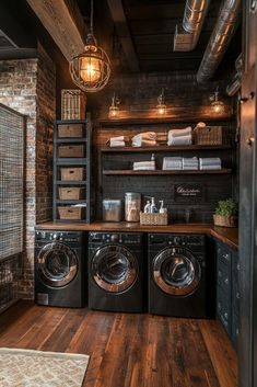 a washer and dryer in a room with brick walls, wood floors and shelves