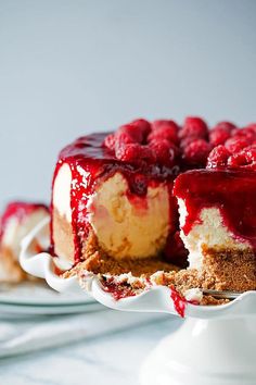 a cheesecake with raspberry sauce on top