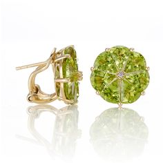 The birthstone for August, peridot is believed to bring good luck, and encourage confidence and bravery. Since 1861, Gump's has been a destination for jewelry that is distinctive, extraordinary and timeless. To ensure each piece is created to our exacting standards, our expert in-house jewelry team oversees every step of the production process. The result is a statement of pure elegance. Peridot, 9.00ctw. Diamonds. 14-karat yellow gold. Pierced only. 5/8" diam. Luxury Peridot Jewelry For Formal Occasions, Luxury Yellow Gold Peridot Jewelry, Elegant Peridot Jewelry With Prong Setting, Luxury Peridot Jewelry For Gifts, Peridot Jewelry With Gemstone Accents, Green Peridot Jewelry With Prong Setting, Peridot Gemstone Jewelry For May Birthstone, Formal Peridot Jewelry For May Birthstone, Peridot Jewelry With Gemstone Accents For May Birthstone