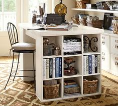 a white desk with lots of books on it