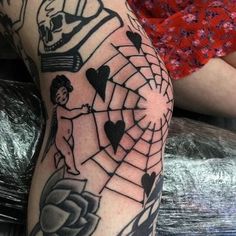 a person with a spider web tattoo on their arm